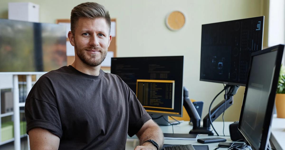 Professional at a desk working on a computer, representing career growth through Lean Six Sigma training.