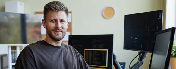 Adult male student sitting at a computer