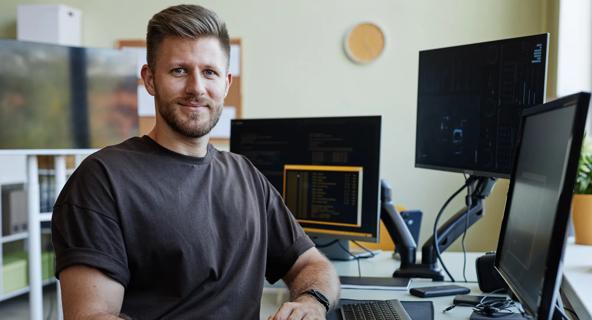 Adult male student sitting at a computer