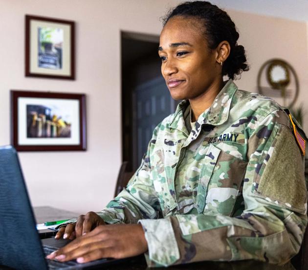 Military service member at computer searching ODUGlobal programs