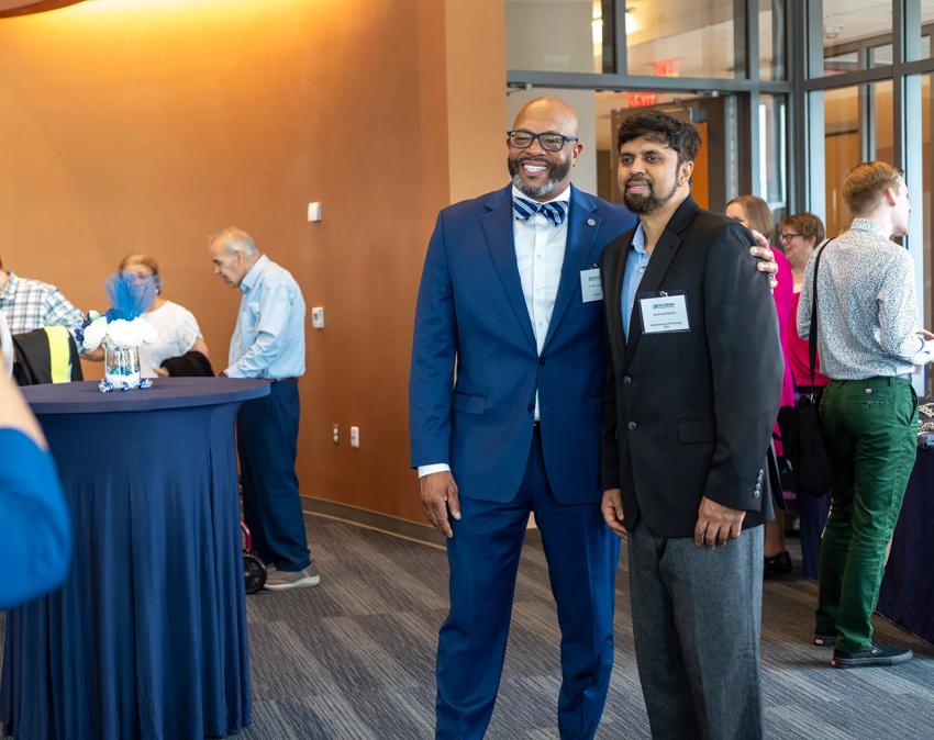 ODU President Hemphill poses for a photo with a graduating student at the ODUGlobal reception.