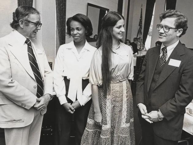Merit scholars who are alumni gather at an university function. President Alfred B. Rollins