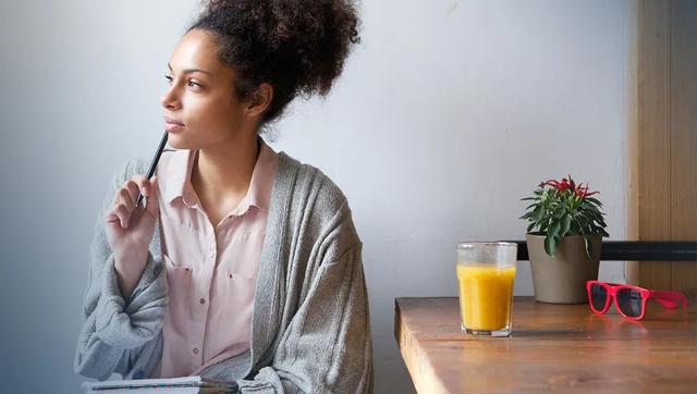 Female student sitting at a table