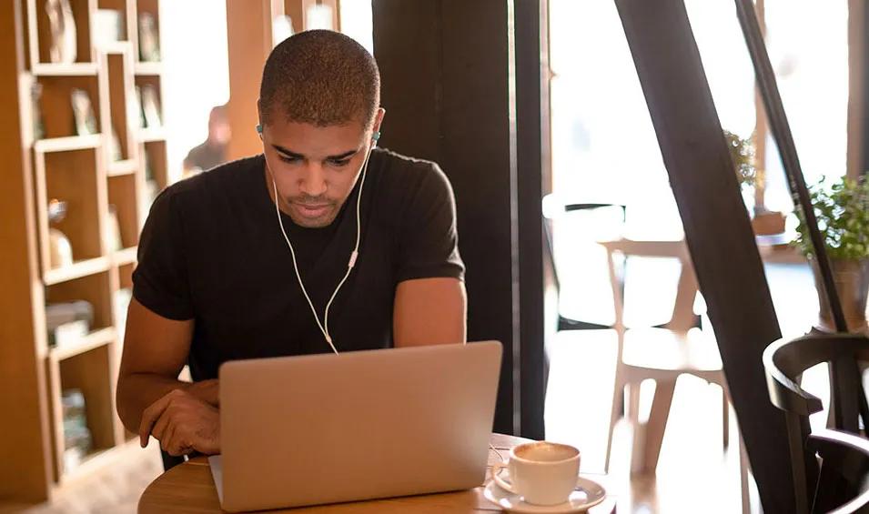 ODUGlobal student attending an online class on a laptop at home.