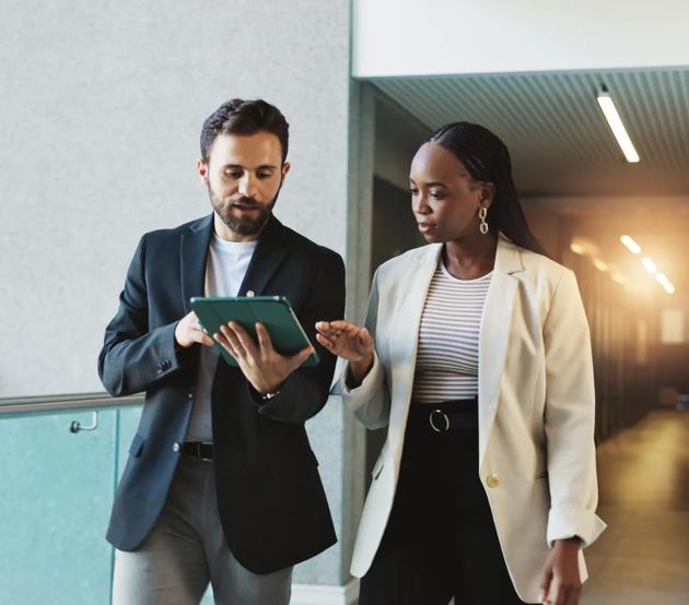 Business, people and walking with tablet for discussion of proposal feedback, investment analysis or meeting briefing. Financial analyst, teamwork and digital report for finance forecasting or review