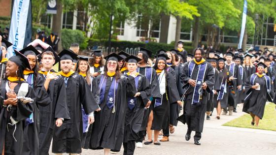 A group of graduates lines up to walk during the ceremony at ODU's commencement.