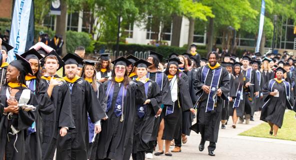 A group of graduates lines up to walk during the ceremony at ODU's commencement.