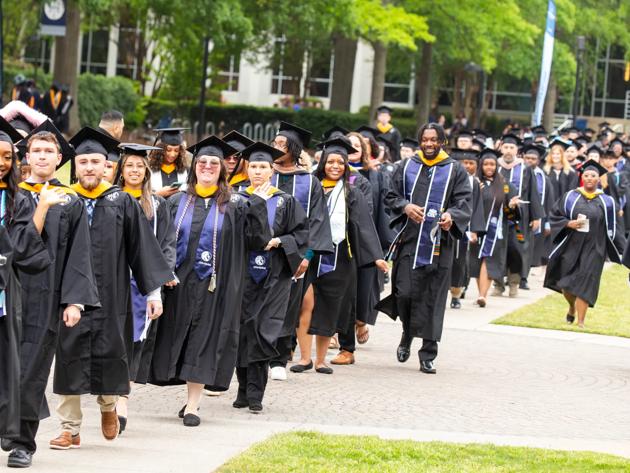 A group of graduates lines up to walk during the ceremony at ODU's commencement.