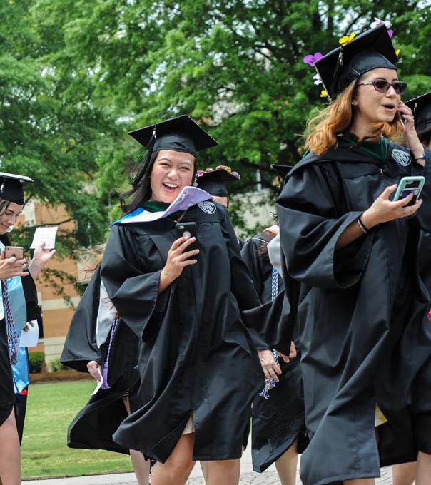 ODU graduates walk across the seal on commencement day