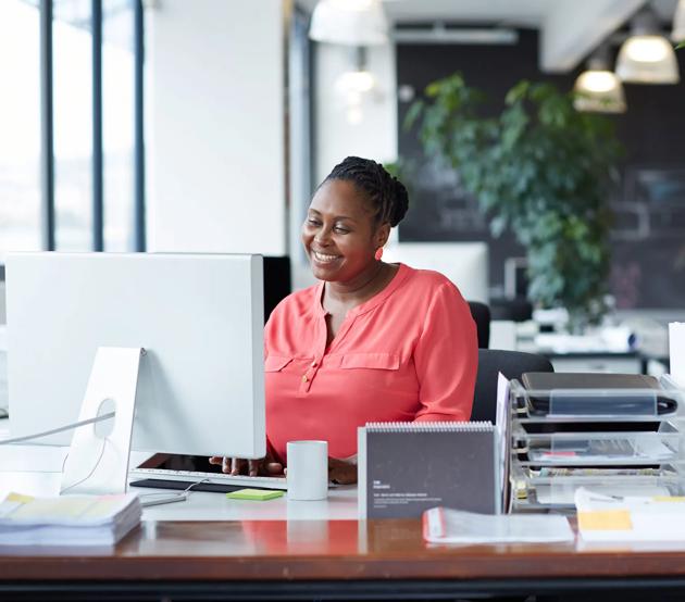 Woman working at desk in an open office