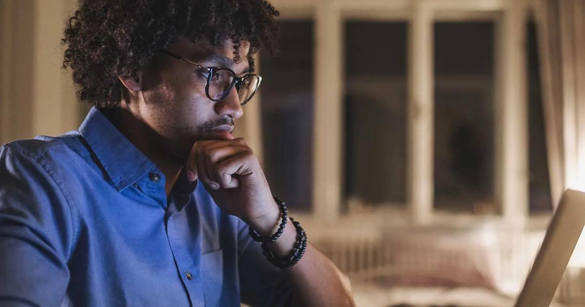 Young man focused on computer