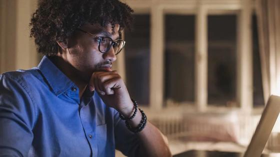 Young man focused on computer