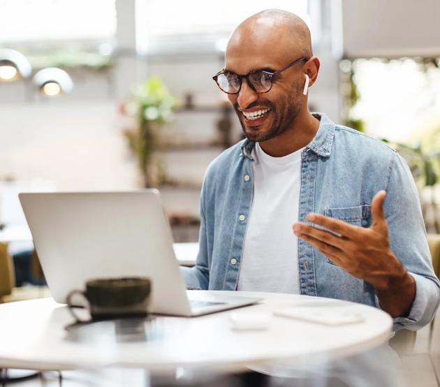 Student on laptop sitting as a table