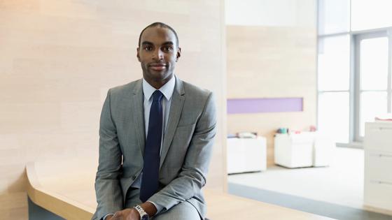 Student studying at the library for an online paralegal certificate program.