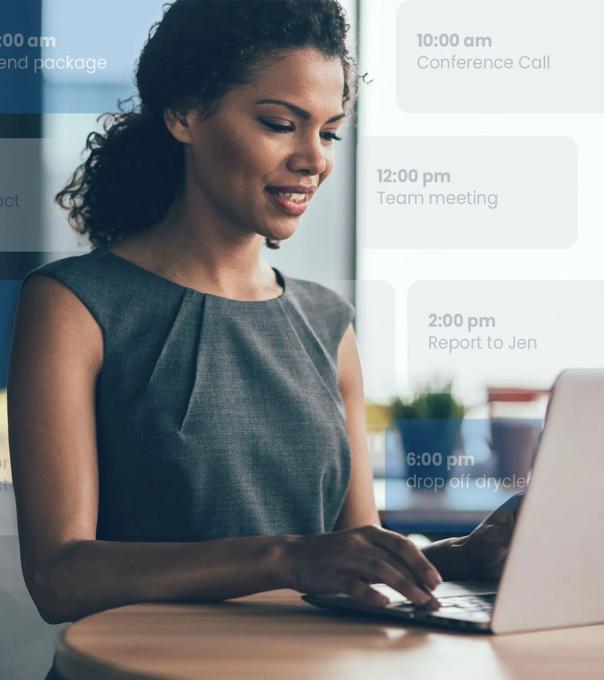 A young professional sits at a computer in an office with her calendar schedule overlaid in the photo's background.