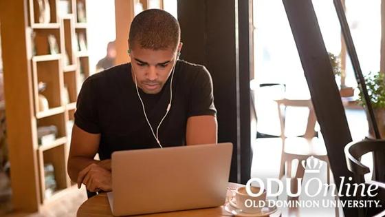 Man studying at laptop with ODUOnline logo in corner