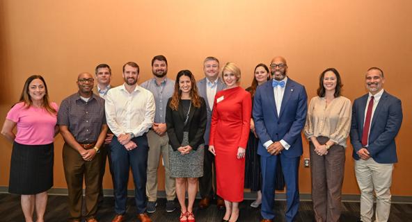Students from the 10th cohort of the Public Sector Leadership graduate certificate pose for a group photo with ODU and USFCC leaders.