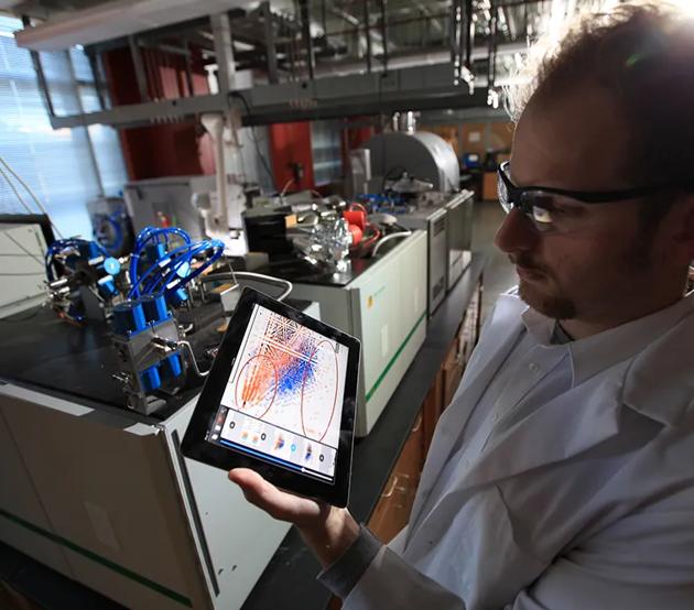 Researcher calculates on tablet