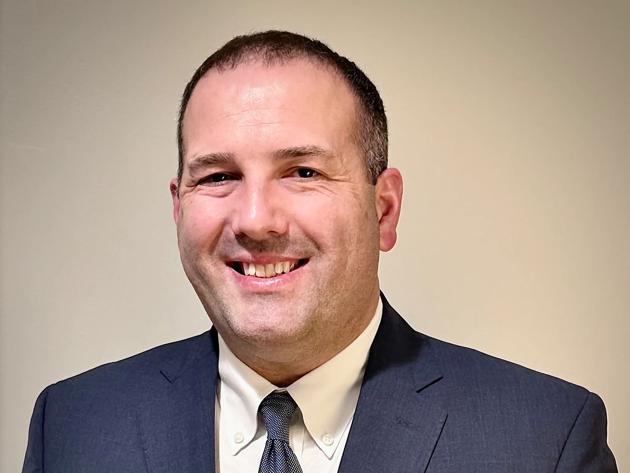 Jay Belknap, associate engineer at Mecklenburg Electric Cooperative and ODU electrical engineering technology student, is helping his rural Virginia utility integrate large-scale data centers into a power grid built for farms and sawmills. 